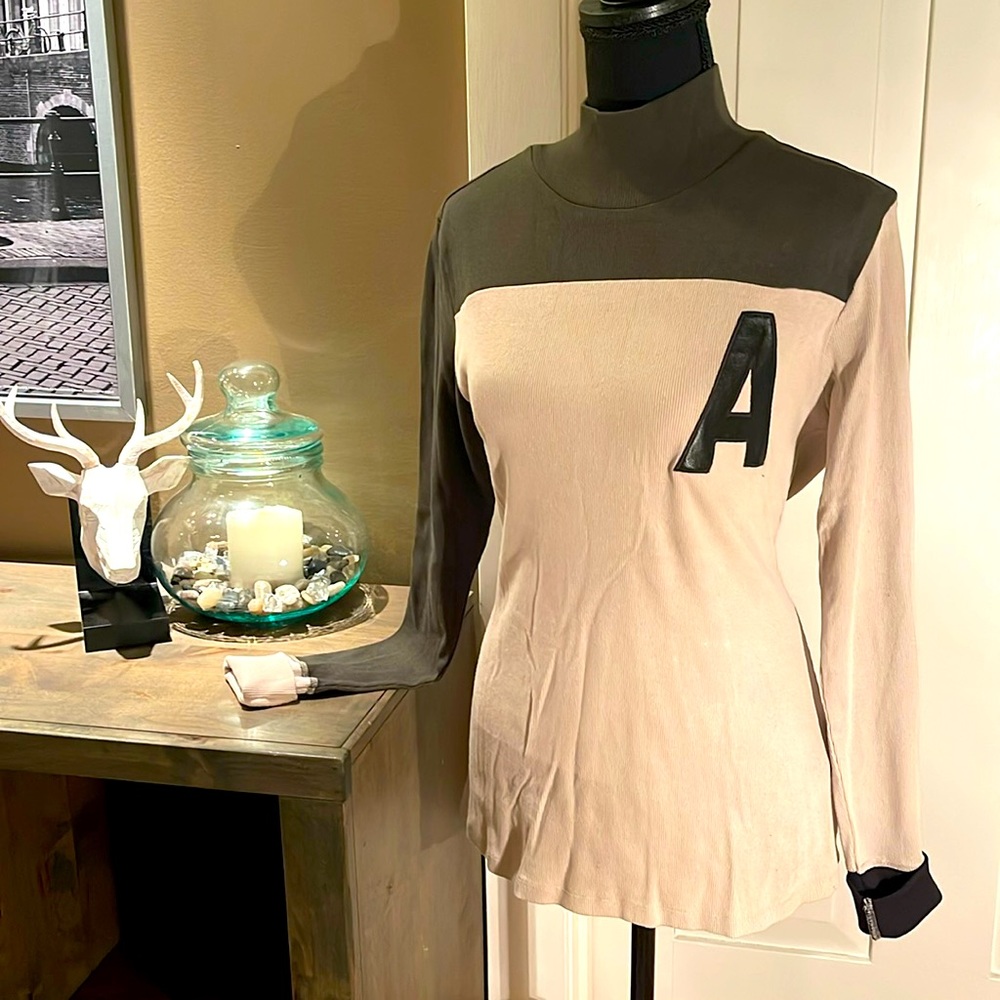 Form fitting stretch mock turtleneck. Never worn. Great with jeans or pants